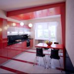 Tavolo rosso nella cucina di una panel house