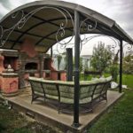 Rattan furniture in the garden gazebo