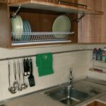 Dish rack inside a hanging cabinet