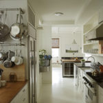 Interior of a two-row kitchen in a private house