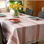 Small cups on the oilcloth on the kitchen table