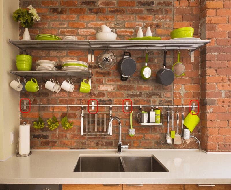 Mounting the kitchen railing on a red brick wall