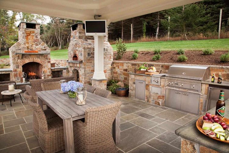 Wicker chairs in the summer kitchen