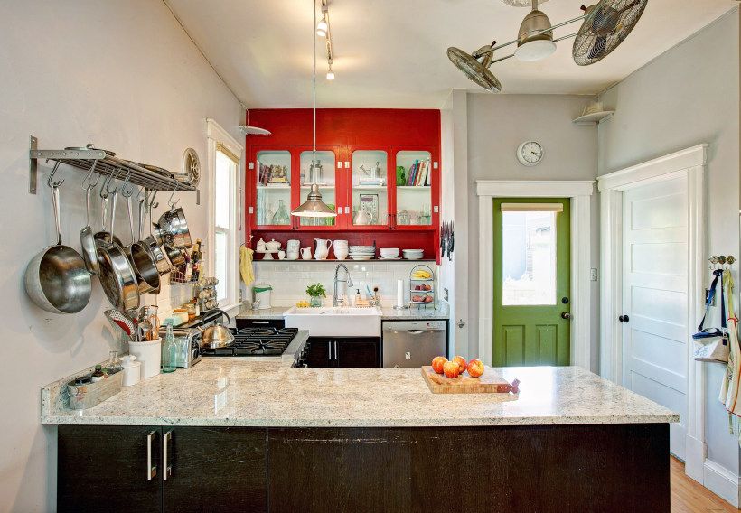 Kitchen interior with stainless steel railing shelves