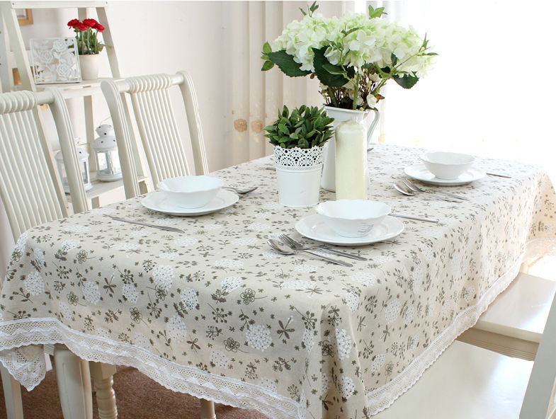 Bright cotton tablecloth on the table in the kitchen