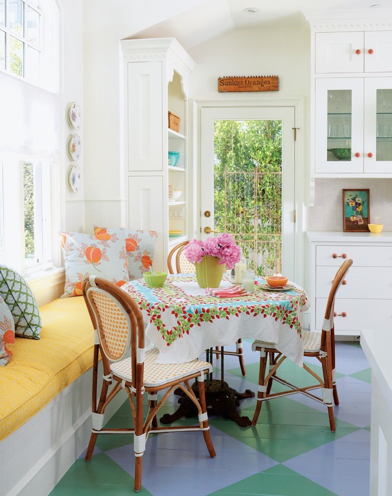 The arrangement of the dining area in the white kitchen