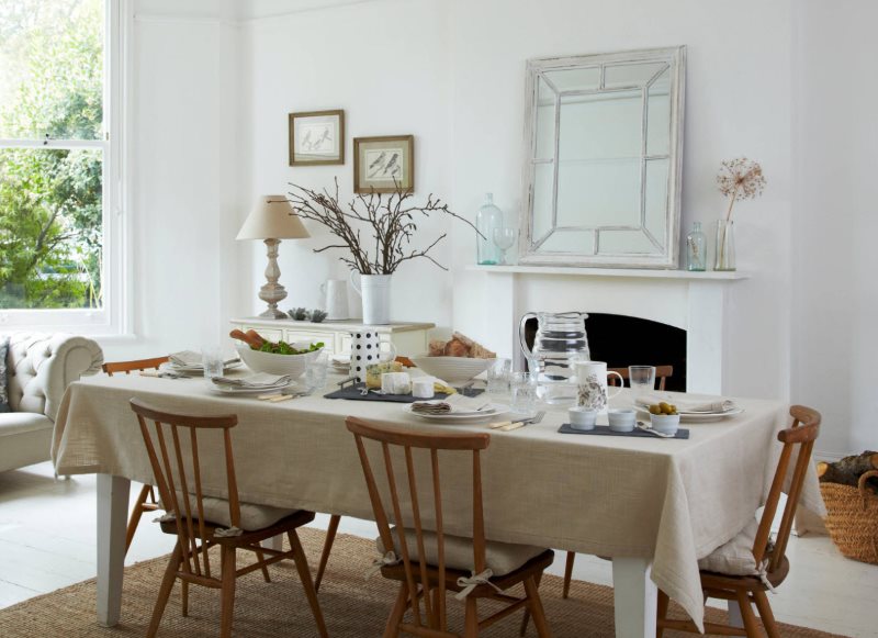 Large kitchen table with plain tablecloth