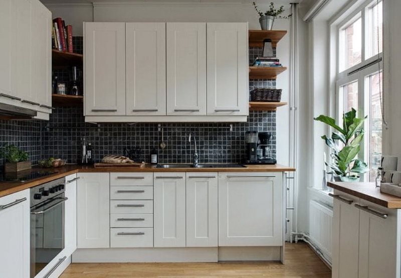 Design of a white kitchen of 9 square meters without curtains on the window