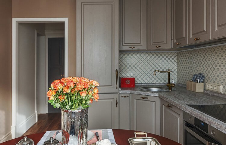 Fresh flowers in a glass vase on the kitchen table