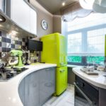 Yellow fridge in the corner of the kitchen