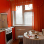 Red curtains on the kitchen window