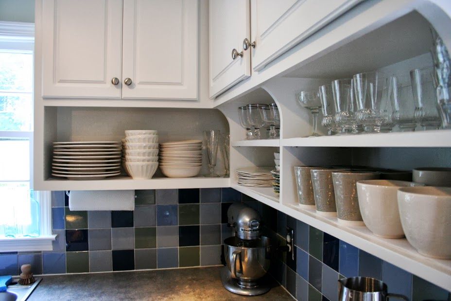 Porcelain dishes on the open shelves of the kitchen