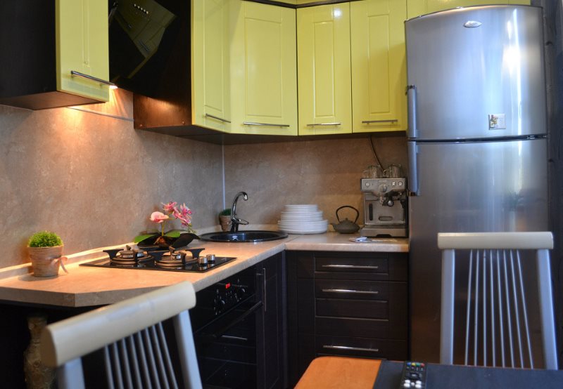 Gray refrigerator in the corner kitchen of Khrushchev