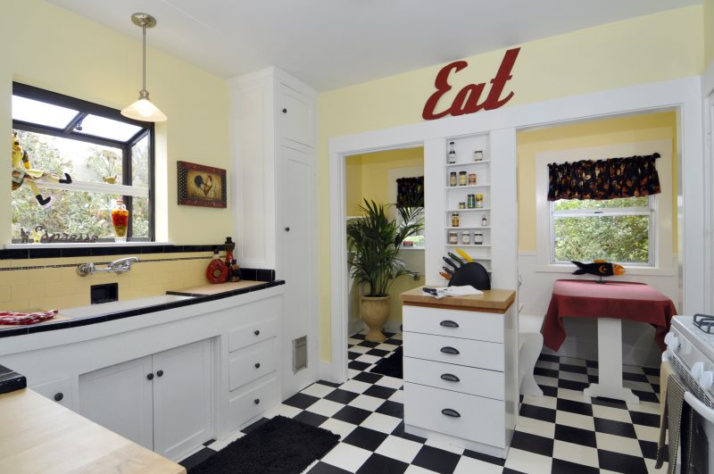 Chess laying ceramic tiles in a retro kitchen