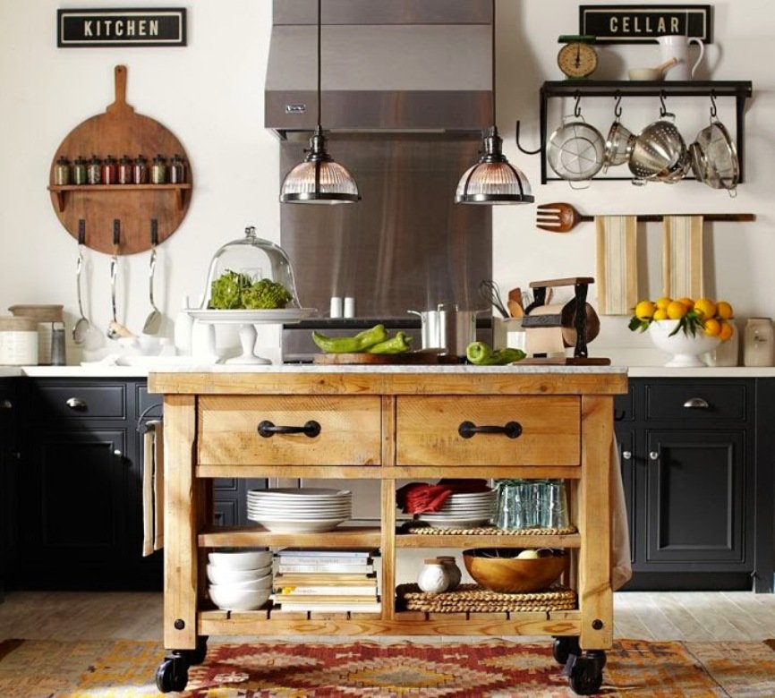 Open shelves with utensils in a mobile kitchen table