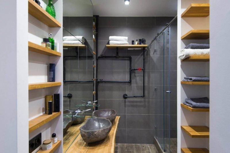 Wooden shelves in the bathroom with gray tiles