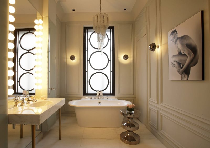 Glass chandelier on the ceiling of a classic bathroom