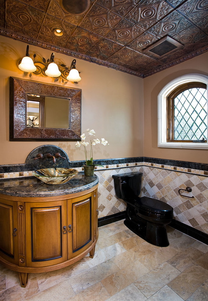 Textured tile on the ceiling of the toilet in oriental style