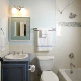 Towel rack over a white toilet