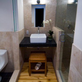 White sink on a black pedestal