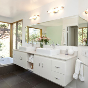 White furniture in the bathroom interior