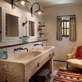 Stone washbasins in the bathroom of a rustic house