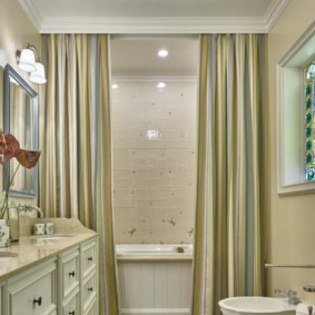 Design bathroom with striped curtains