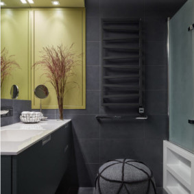 Dark gray tile on the bathroom wall