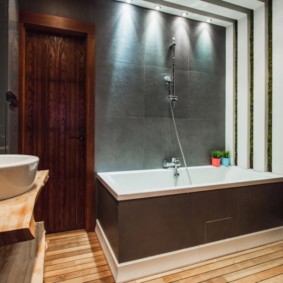 Porcelain sink on a wooden countertop