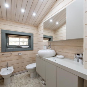 Covering the toilet room with wooden lining