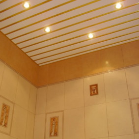 Slatted ceiling with golden accents