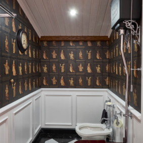 Black and white tiles on the floor of a separate bathroom