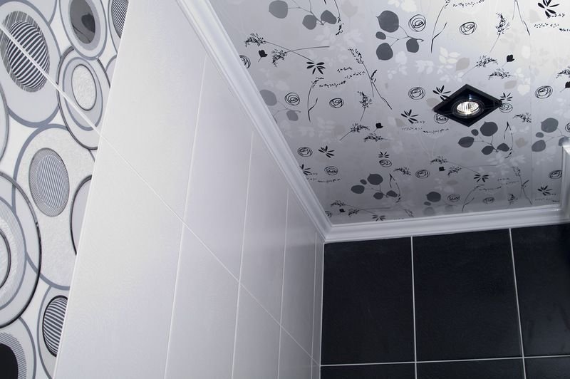 Vinyl wallpaper on the ceiling of a small toilet