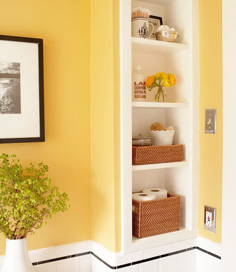 White shelves in the niche of the bathroom wall