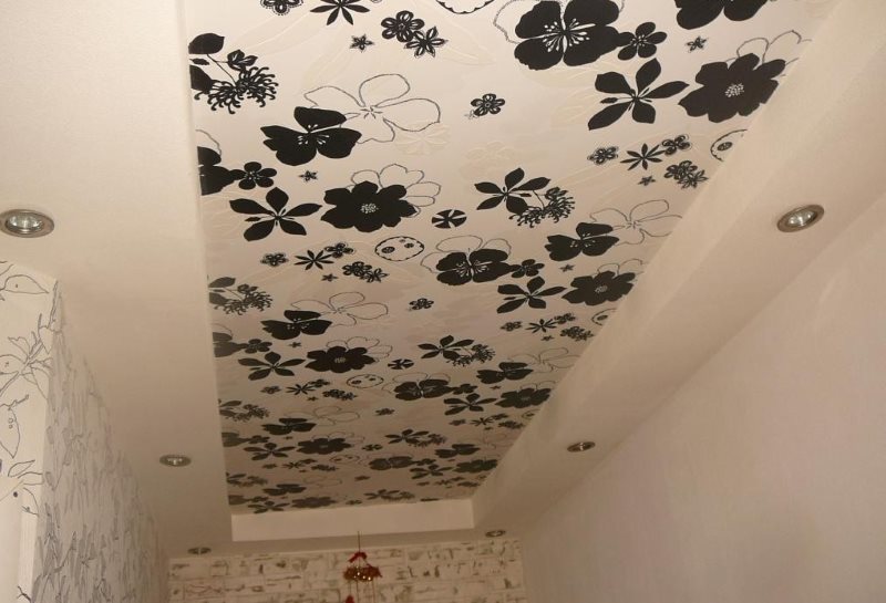 Ob with flowers on the ceiling of a separate bathroom