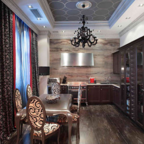 Black chandelier on the ceiling of the art deco style kitchen