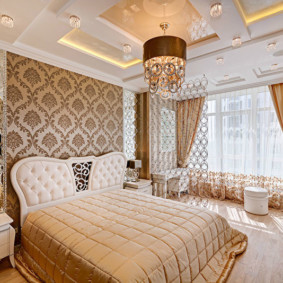 Multi-level ceiling in the interior of a beautiful bedroom