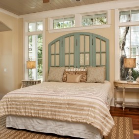 bedroom with a bed by the window photo