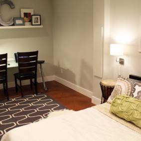 Lamps with lampshades on the bedside tables