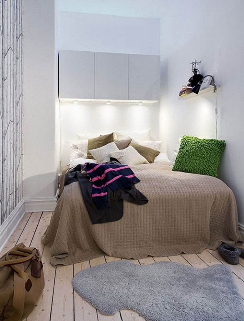 Hanging wardrobes above the bed in the bedroom