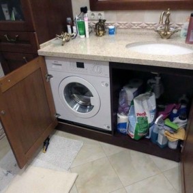 Packs of washing powder in a chipboard cabinet