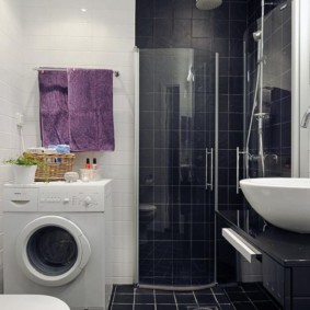 Lilac towel on the wall in the bathroom