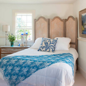 diagonal bedroom with a bed by the window