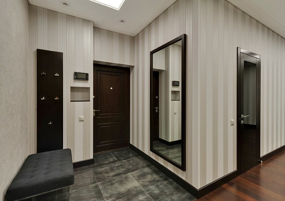 Entrance hall of a city apartment with a dark door