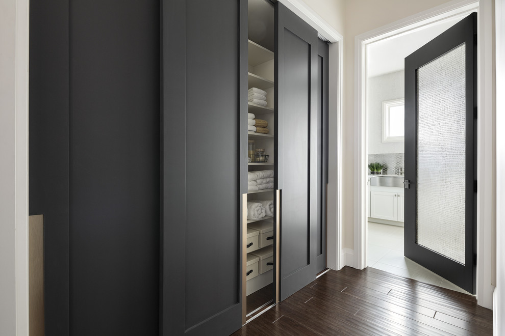 Minimalist corridor interior with dark doors.