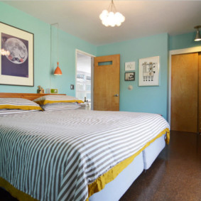 Striped bedspread on a wide bed