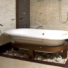 Wooden base under an acrylic bathtub