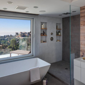 Convenient shelves in the niche of the bathroom wall