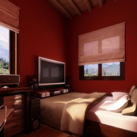 Burgundy walls of the bedroom with a desk