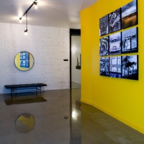 Collection of photos on a yellow wall